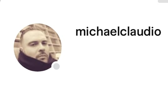 Circular profile photo of bearded man