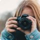 Person photographing with DSLR camera